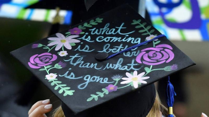Decorated graduation cap that says, "what is coming is better than what is gone."