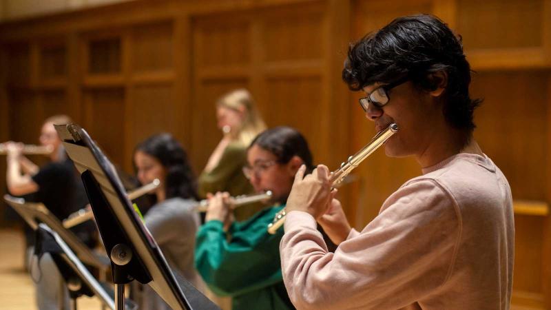 Students playing flutes