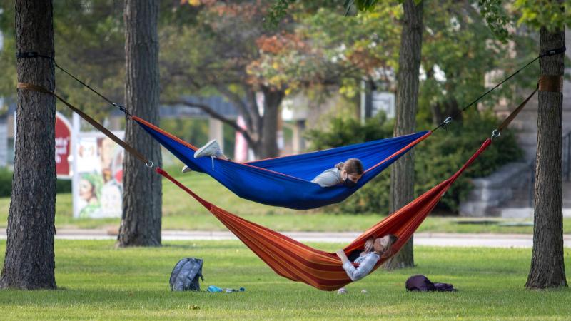 Students lay in hammocks on Main Hall Green