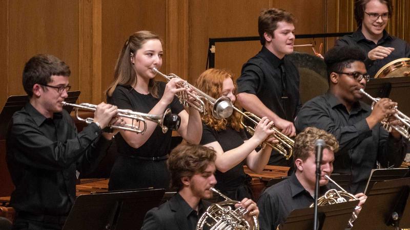 Students playing brass instruments