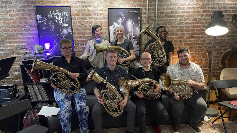 The Lawrence Graduate Bayreuth Tuben Quintet poses for a photo with their Wagner tubas.
