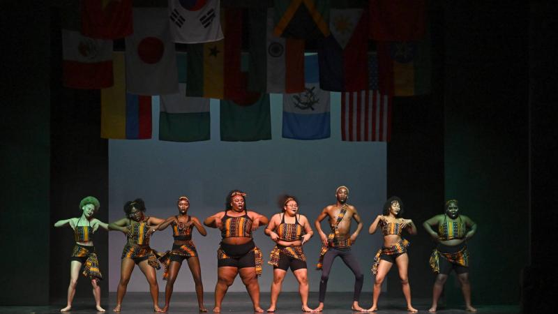 Students performing dance from West Africa onstage during Cabaret.