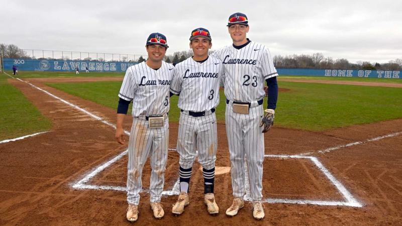 Lawrence seniors pose near home plate at Whiting Field: from left, Spenser Ross, Colin Wieska and Jacob Charon.