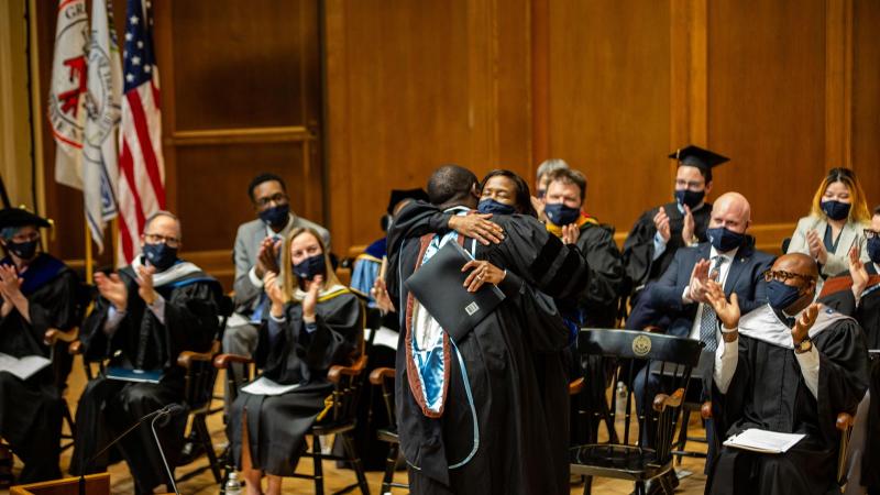 President Laurie A Carter hugs Robert Battle