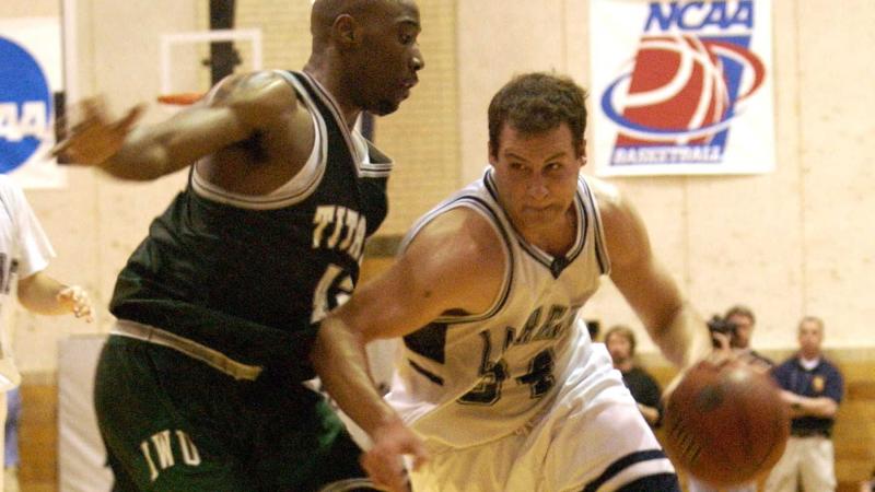 Chris Braier drives to the basket in a Lawrence basketball game.