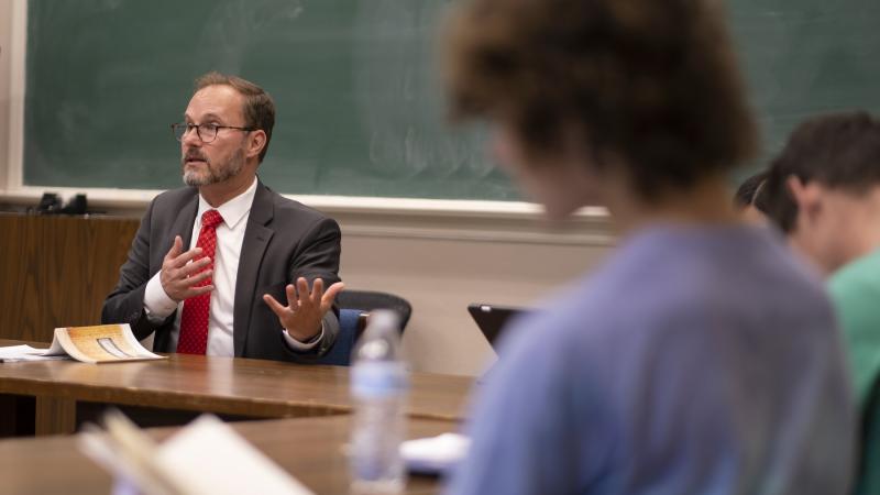 Professor Garth Bond talks about Natasha Tretheway's Native Guard during a First-Year Studies course in Main Hall. (Photo by Danny Damiani)