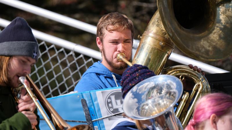 Horns are played by students at last year's Blue & White Weekend tailgate party. 