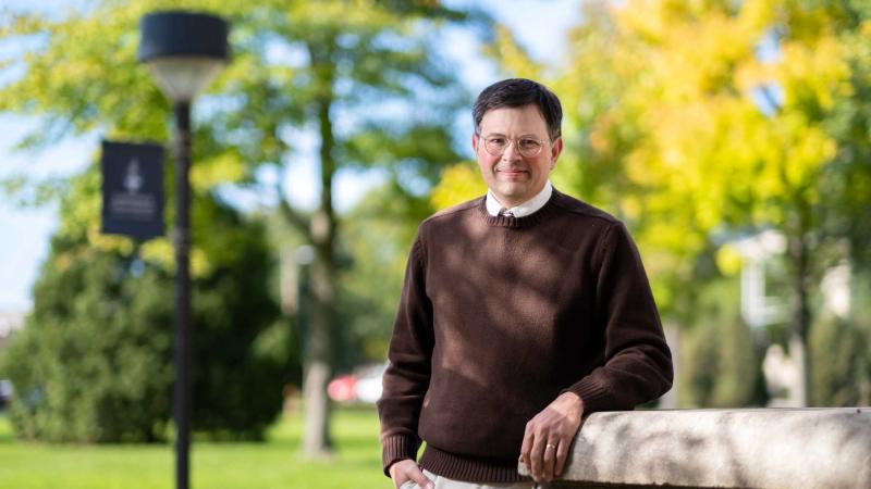 Arnold Shober poses for a photo on Main Hall Green. 