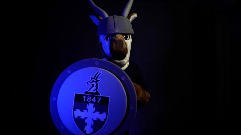 Lawrence Antelope Viking Mascot holding shield