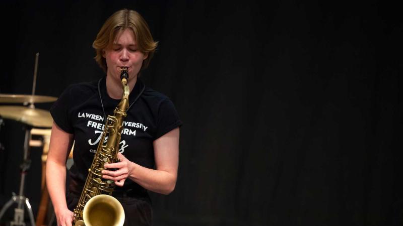 Lucy Croasdale plays the saxophone in Cloak Theater during Jazz Weekend.