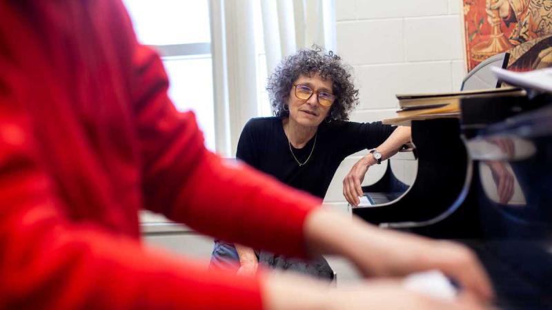 Catherine Kautsky works with piano student Jasmine Maller during a teaching session..