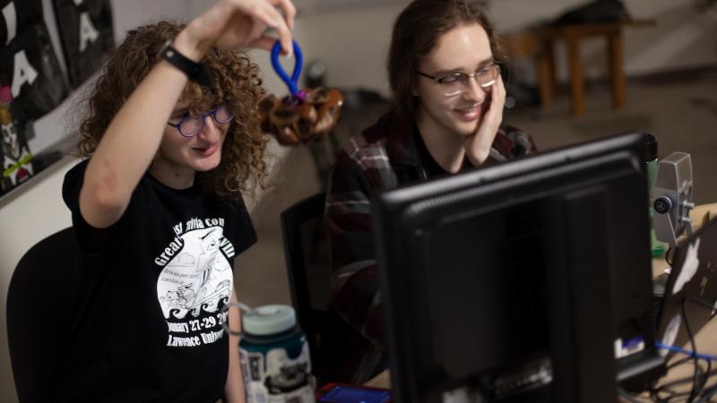 Willow Higgins and Nick Mayerson work the livestream during the Great Midwest Trivia Contest .