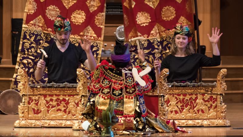 students play gamelan instruments