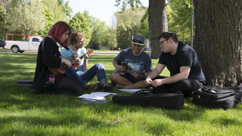 students outside making music