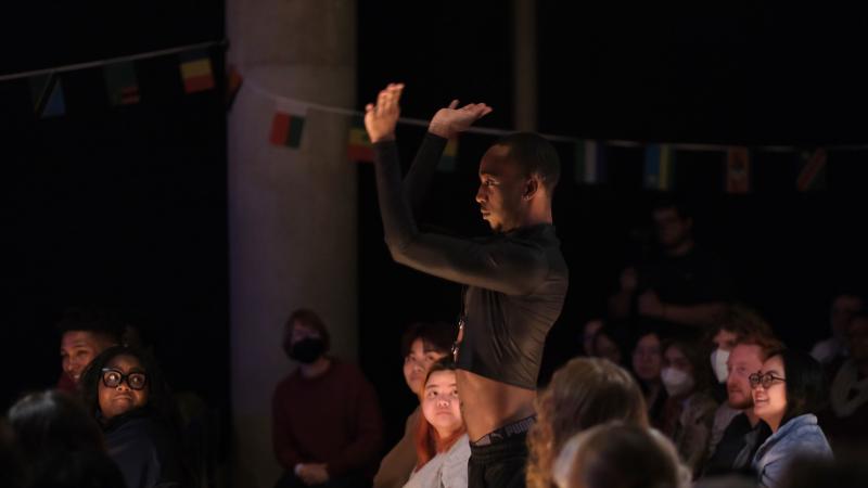 Crowd watches a dancer perform.