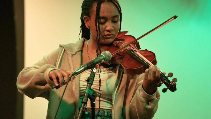 A student performs on the violin.