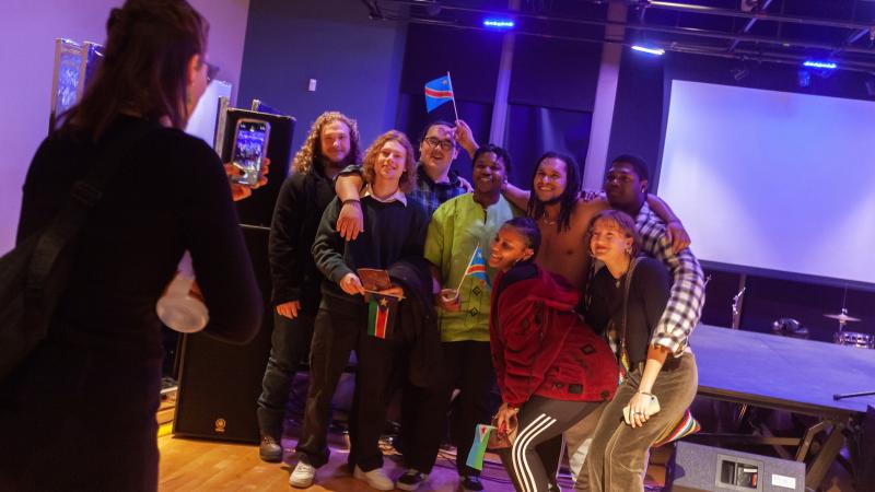 A group of students pose for a photo at Cultural Expressions.