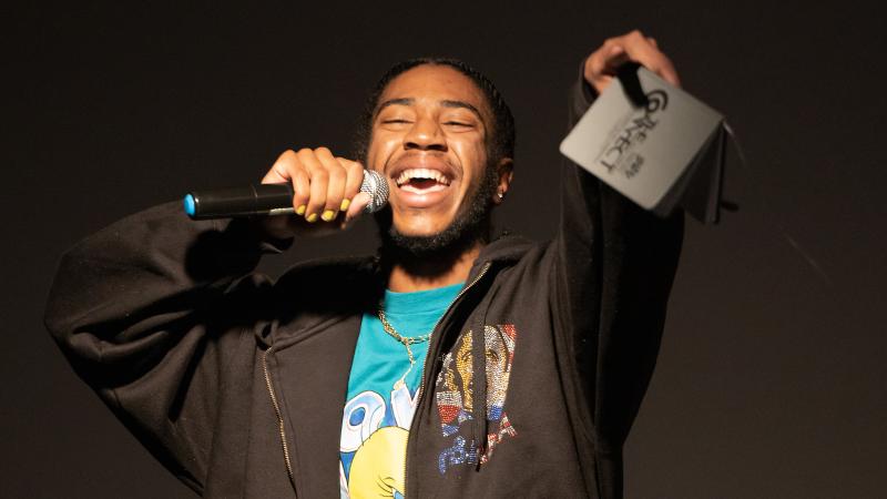 A singer gestures to the audience during a song.