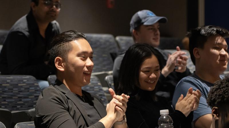 Alec Nguyen, a senior claps his hands after being announced as the first place finisher in Launch LU.