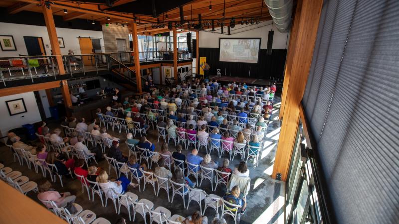 An audience looks on at Poplar Hall as the Appleton documentary is shown.