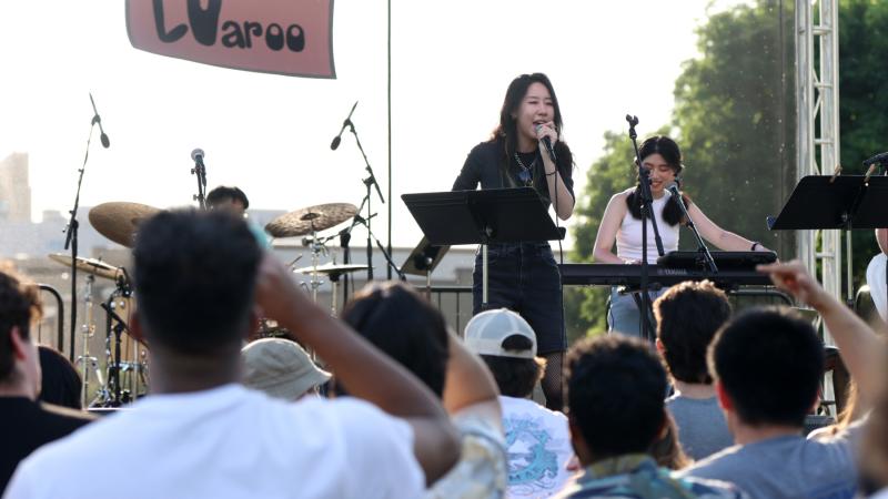 Fusion draws a big crowd in front of the stage during their performance.