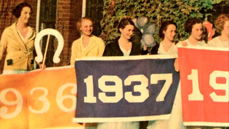 Downer students holding class color banners