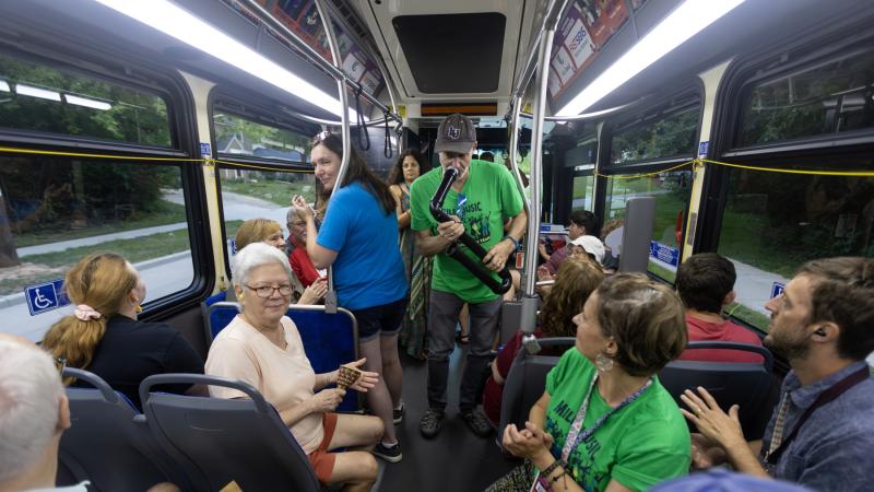 Brian Pertl and other members of the Music Education Team engage with passengers on the Mile of Music Bus.