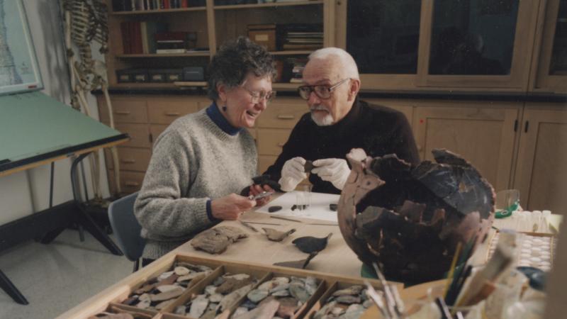 Ronald Mason works on research with his wife, Carol, in 1999.