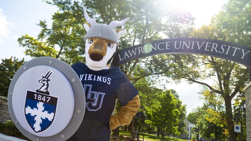 Blu, the Lawrence mascot, stands in front of the Lawrence Arch.