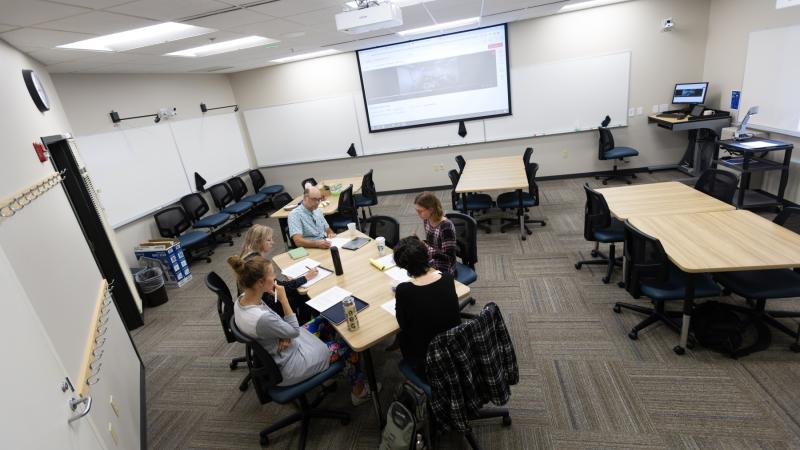 Stephanie Burdick-Shepherd leads a group of Lawrence faculty in discussion in the Center for Teaching Excellence classroom in Briggs Hall.