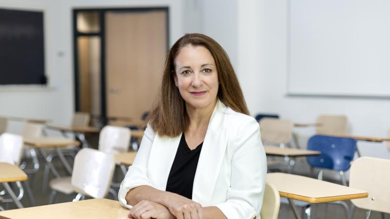 Rosa Tapia poses for a photo in a Lawrence classroom.