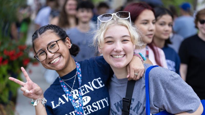 First-year students smile for the camera as they prepare to walk to the President's Welcome.