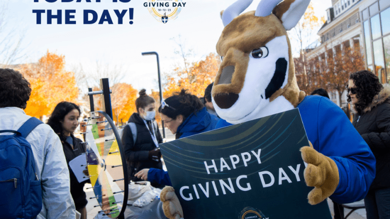 Blu Holding Giving Day Sign