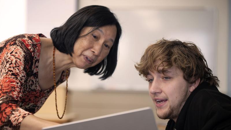 Teacher helping a student