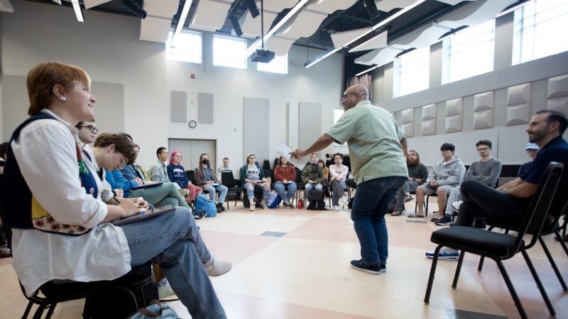 José Encarnación talks with students in Shattuck Hall as part of a How to Practice course.