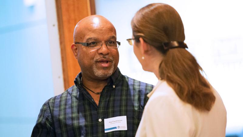 Juan Encarnacion speaking with attendee of LU Diversity Conference