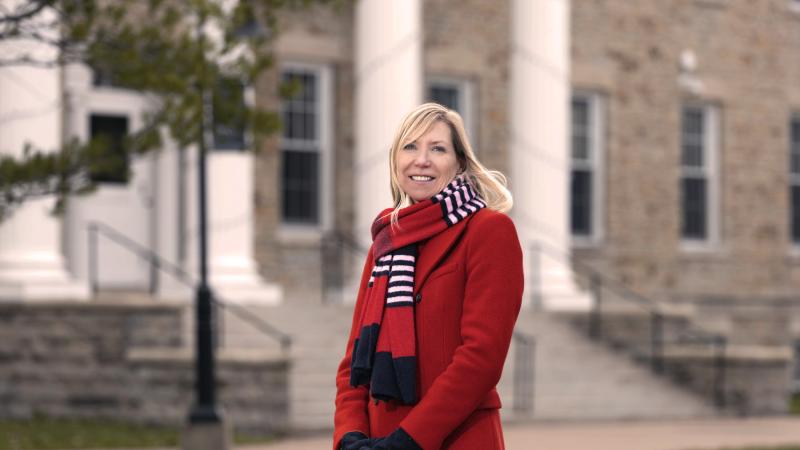 Judith Humphries poses for a portrait while standing in front of Main Hall.