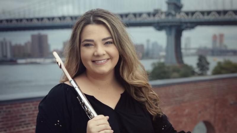 Schuyler Thornton '14 holds her flute as she poses for a photo. 