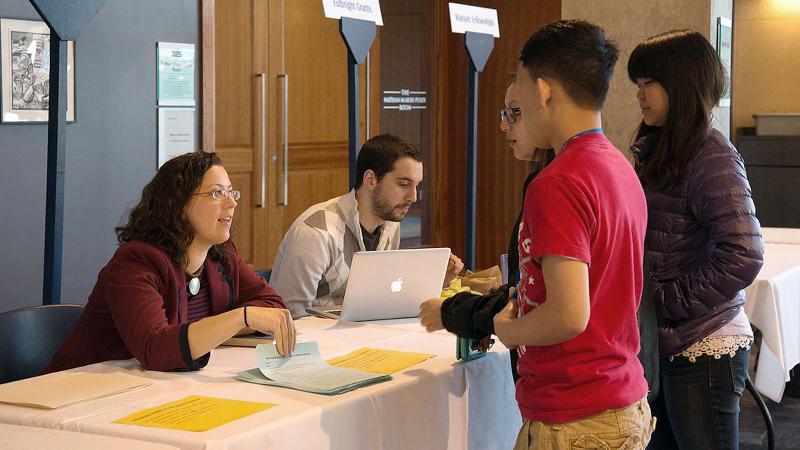 International students discussing fellowships and scholarships with staff