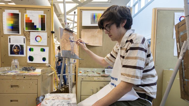 Student painting in Wriston
