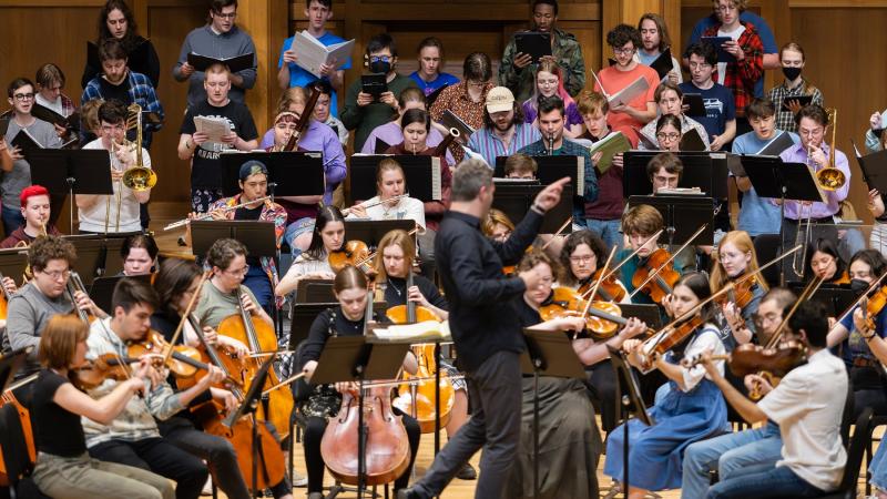 Led by Mark Dupere, Lawrence students rehearse on stage in Memorial Chapel for the April 19 Major Works Concert.