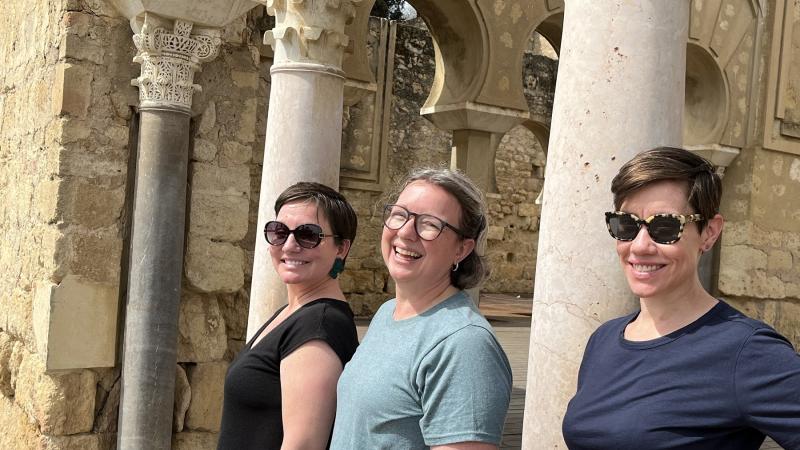 Madera Allan, Danielle Joyner, and Sara Gross Ceballos pose for a photo in the 10th-century ruins of Madinat al-Zahra, the palace complex built outside of Córdoba.  