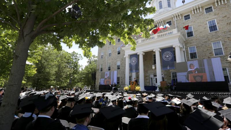 Pawo Choyning Dorji '06 addresses graduates and guests at Lawrence University's 2024 Commencement June 9 on Main Hall Green.