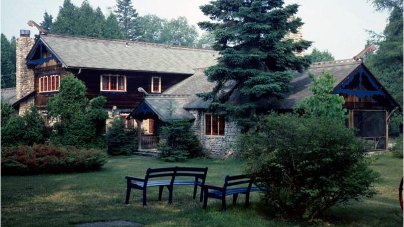 a cabin situated in the trees