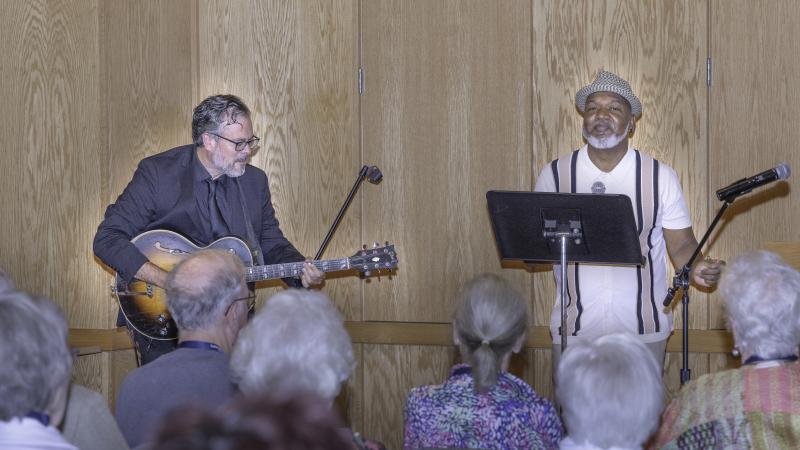 a guitarist and vocalist perform