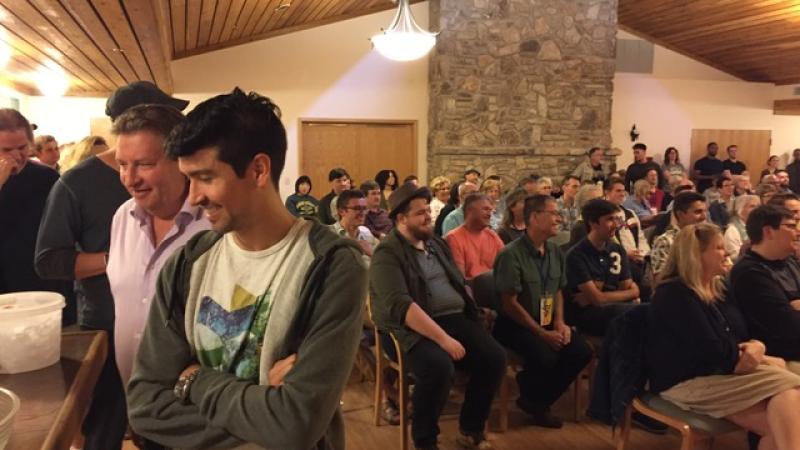 a crowd of people in Vail Hall at Bjorklunden