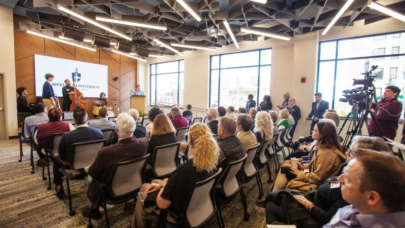 Business & Entrepreneurship Center Commons with people attending a presentation