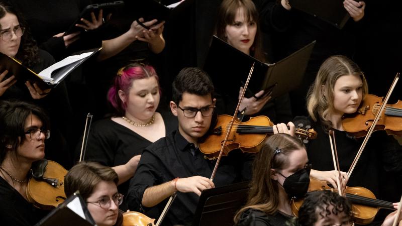 Tomas Aviles plays violin during the Major Works concert in Memorial Chapel in spring 2024.