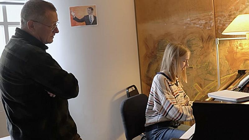 Bill Carothers with student in piano studio