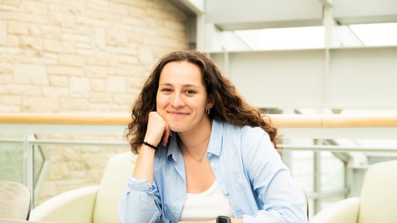Emma Moya poses for a photo in the Steitz atrium.